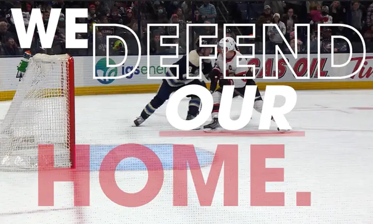 we defend our home text overlay on top of image of columbus blue jackets hockey players