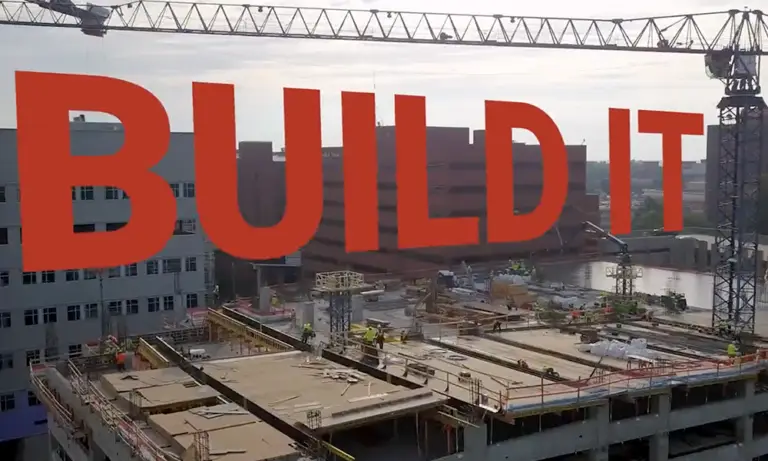 red text overlay saying "build it" overtop construction site