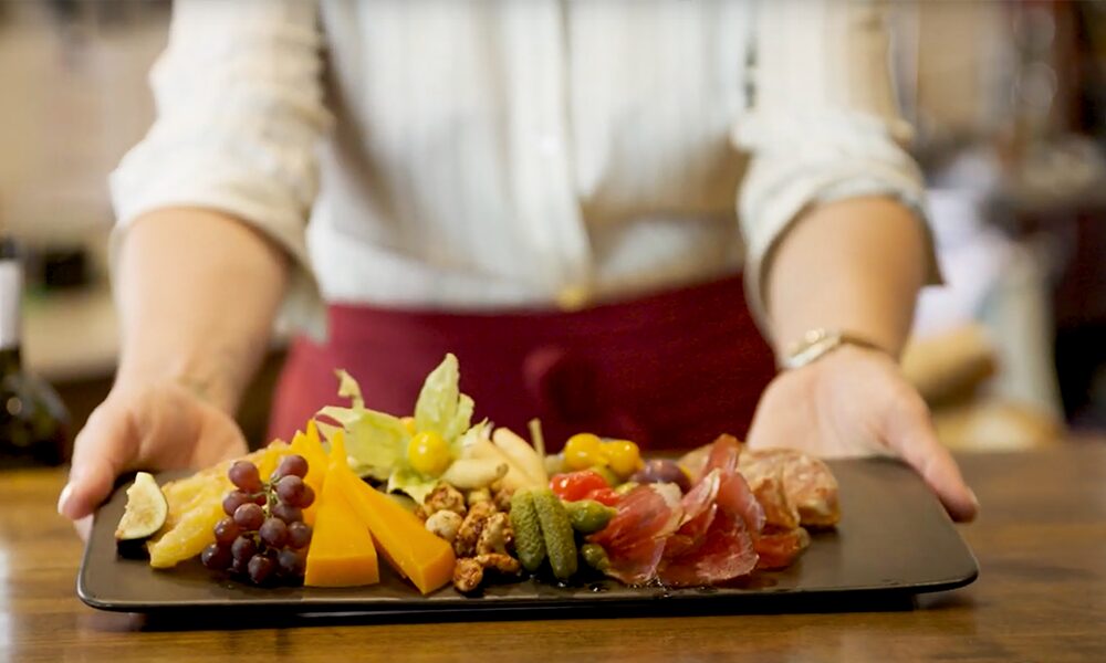 yampa valley bank video thumbnail person displaying charcuterie board