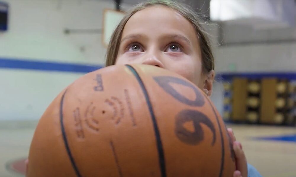 yampa valley bank video thumbnail, girl holding basketball looking up